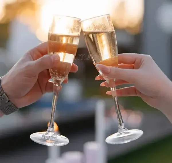 champagne-toast-couple-hands-close-up-holding-glasses-making-celebration-event-outdoors-sunset-love-connection-happiness-465227010