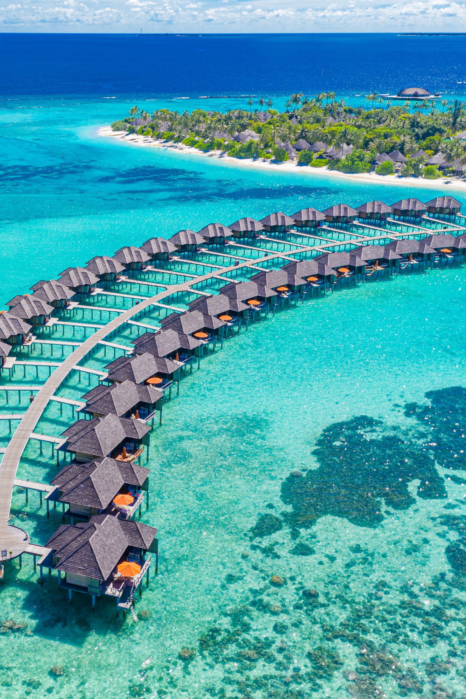 maldives-paradise-beach-tropical-aerial-landscape-seascape-with-long-pier-water-villas-palm-tree