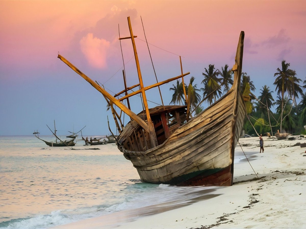 wooden-fishing-ship-white-sand-beach-low-tide-indian-ocean-zanzibar-tanzania-scaled